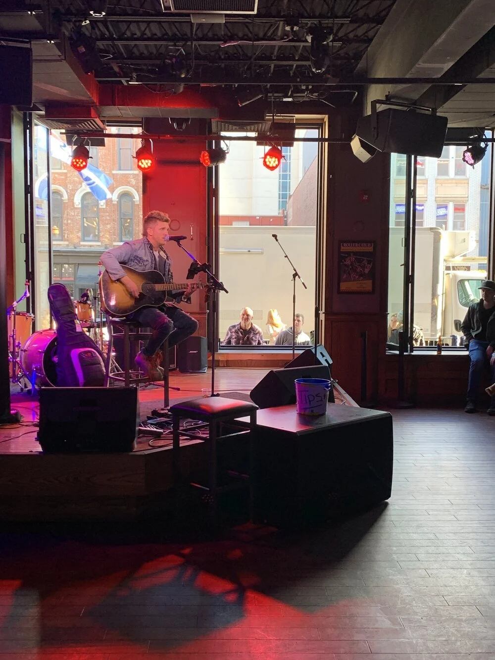 Country artist performing solo in Nashville bar